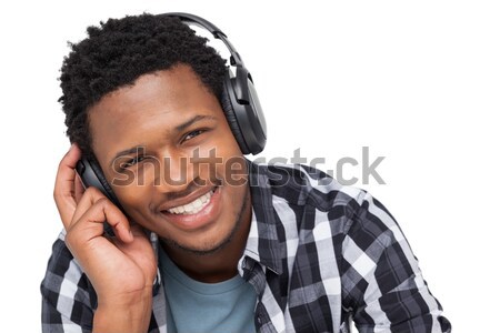 Zdjęcia stock: Człowiek · słuchanie · muzyki · słuchawki · biały · zamyślony · muzyki