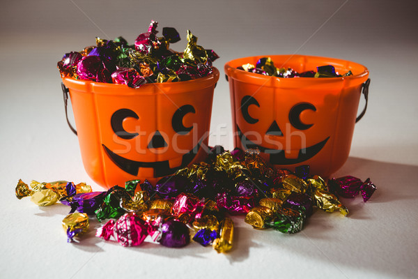 Orange buckets with colorful chocolate Stock photo © wavebreak_media