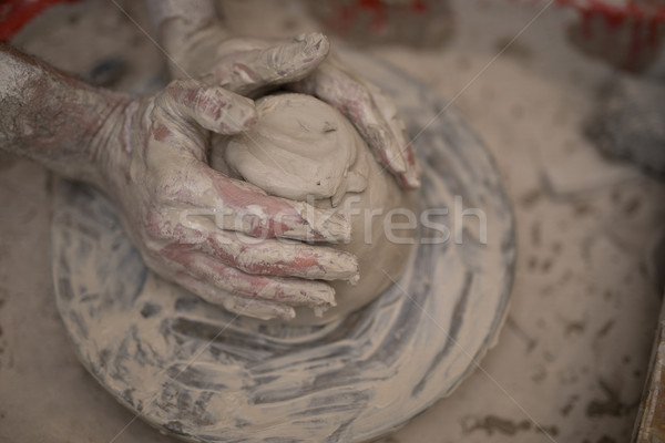 Stock photo: Male potter molding a clay