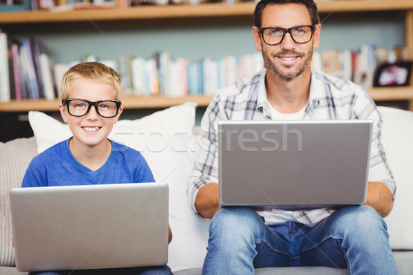 Portrait of father and son working on laptop Stock photo © wavebreak_media