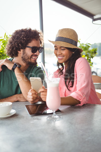 Couple looking at mobile phone Stock photo © wavebreak_media