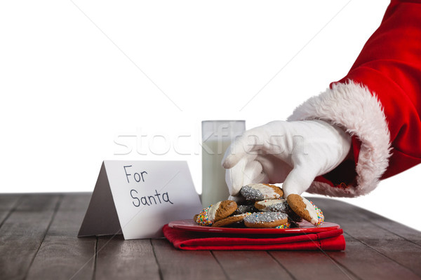 Close-up of santa claus taking cookies Stock photo © wavebreak_media