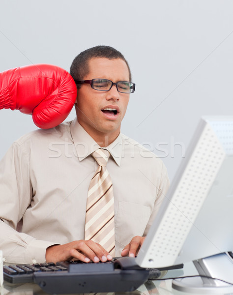 Young businessman being boxed in the office Stock photo © wavebreak_media