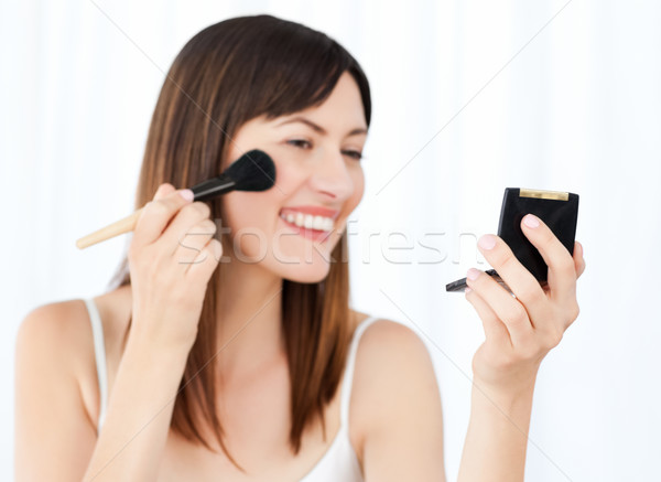 Beautiful woman putting on Make up Stock photo © wavebreak_media