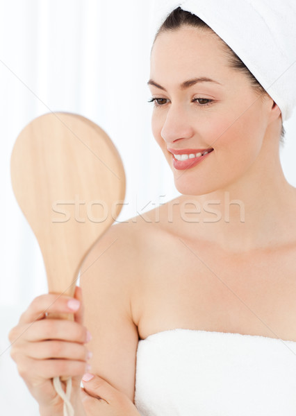 Attractive woman putting on Make up Stock photo © wavebreak_media