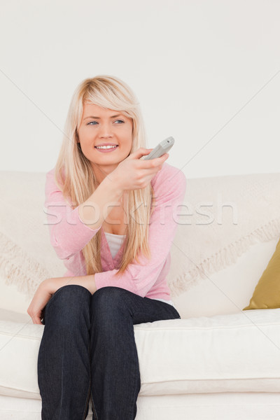 красивый блондинка женщины позируют сидят диван Сток-фото © wavebreak_media
