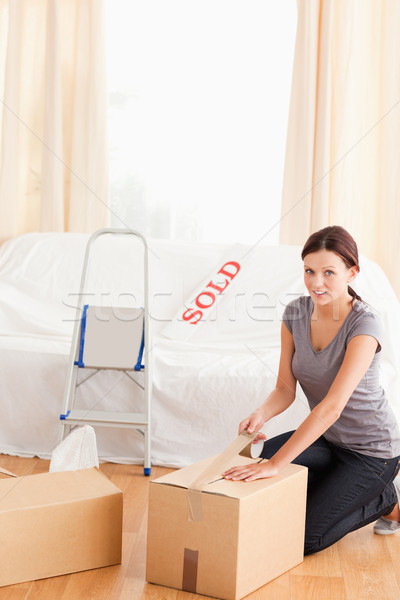 A woman is preparing cardboards for transport Stock photo © wavebreak_media
