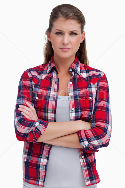 Portrait of a serious woman with the arms crossed against a white background Stock photo © wavebreak_media