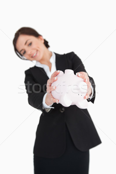 Businesswoman emptying a piggy-bank against white background Stock photo © wavebreak_media