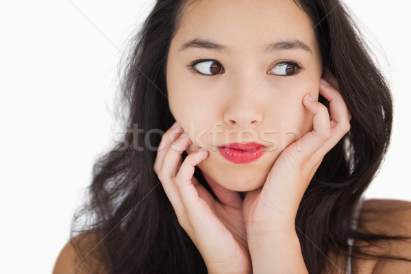Woman looking afraid against white background Stock photo © wavebreak_media