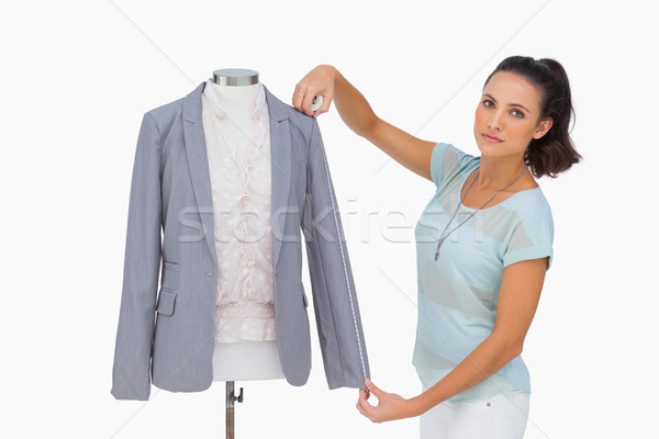 Designer measuring blazer sleeve on mannequin  Stock photo © wavebreak_media