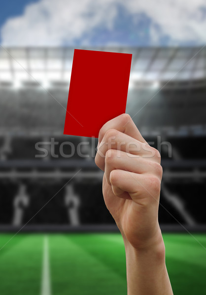 Composite image of hand holding up red card Stock photo © wavebreak_media