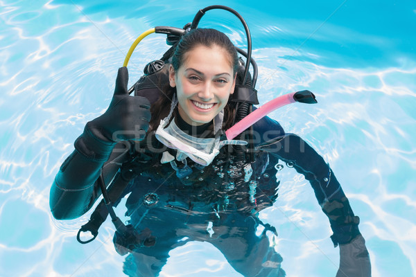 Smiling woman on scuba training in swimming pool showing thumbs  Stock photo © wavebreak_media