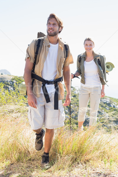 Randonnée couple marche montagne sentier [[stock_photo]] © wavebreak_media