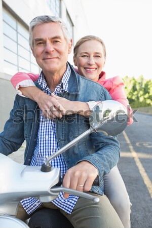 Happy senior couple riding a moped  Stock photo © wavebreak_media