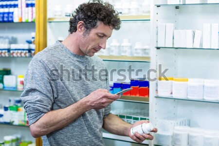 Smiling hairdresser with hair products Stock photo © wavebreak_media