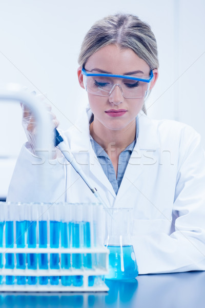 Science student using pipette in the lab Stock photo © wavebreak_media