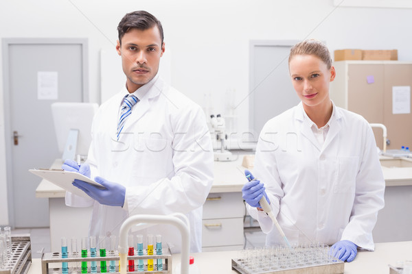 Scientists examining tubes  Stock photo © wavebreak_media