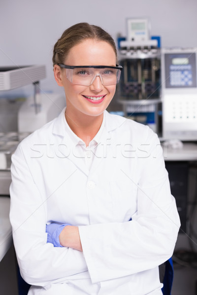 Smiling scientist looking at camera arms crossed Stock photo © wavebreak_media