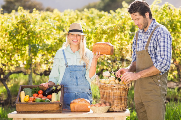 Heureux agriculteur femme pain portrait [[stock_photo]] © wavebreak_media