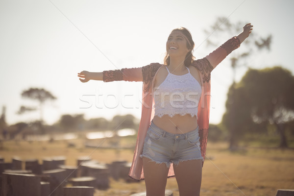 Happy woman standing on field Stock photo © wavebreak_media
