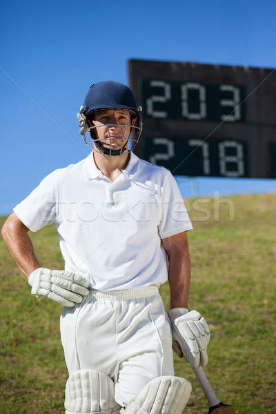 Confident cricket player with bat at field Stock photo © wavebreak_media