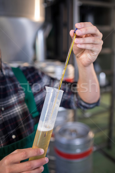 Cropped hand of worker testing beer Stock photo © wavebreak_media