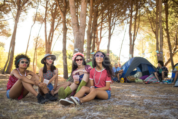 Young female friends sitting at campsite Stock photo © wavebreak_media