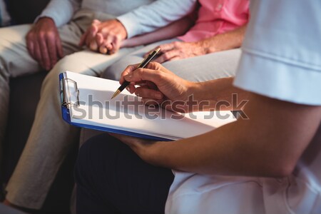 Midsection of senior man reading braille book at table Stock photo © wavebreak_media