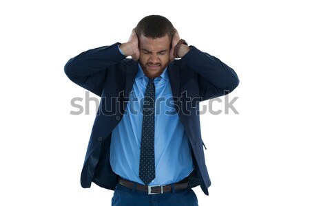 Irritated businessman covering his ears Stock photo © wavebreak_media