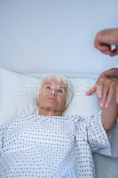 Doctor examining senior patient in ward Stock photo © wavebreak_media