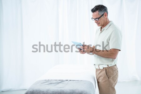 Androgynous man using digital tablet Stock photo © wavebreak_media