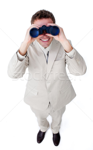 Happy businessman looking through binoculars Stock photo © wavebreak_media