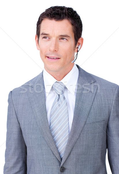 Stock photo: Self-assured male executive with headset on 