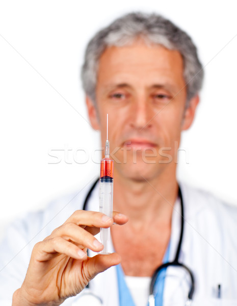 Orvos bemutat injekciós tű fehér munka kórház Stock fotó © wavebreak_media