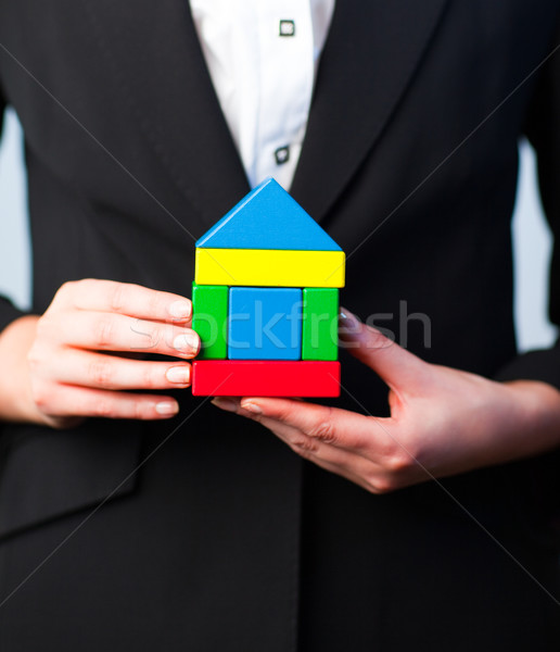 Woman holding a house  Stock photo © wavebreak_media