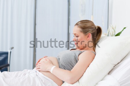 Pregnant young woman on a hospital bed Stock photo © wavebreak_media