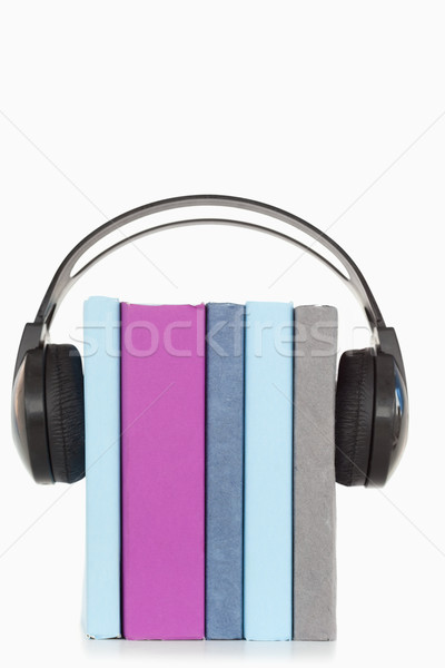 A stack of books and headphones against a white background Stock photo © wavebreak_media