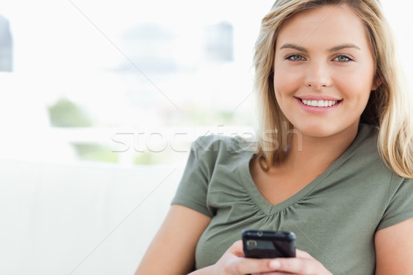 Kobieta telefonu ręce uśmiechnięty patrząc Zdjęcia stock © wavebreak_media