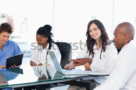 Mosolyog orvosi csapat dolgozik mindkettő laptop Stock fotó © wavebreak_media