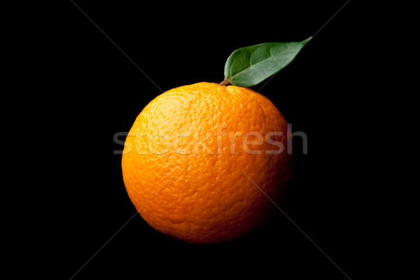 Orange with leaf against a black background Stock photo © wavebreak_media