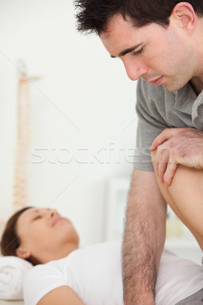 Patient being stretched by a physiotherapist in a room Stock photo © wavebreak_media