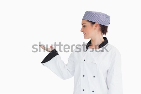 Chef holding hand out to left in presentation Stock photo © wavebreak_media