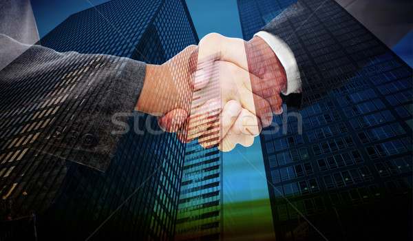 Composite image of handshake between two business people Stock photo © wavebreak_media