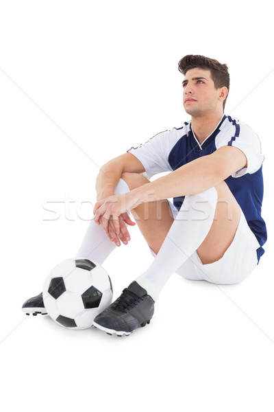 Football player sitting on the ground with ball Stock photo © wavebreak_media