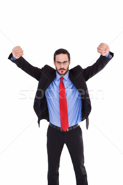 Unsmiling businessman standing with arms raised Stock photo © wavebreak_media