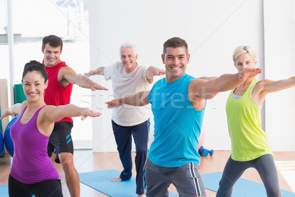 Insanlar savaşçı poz yoga sınıf mutlu Stok fotoğraf © wavebreak_media