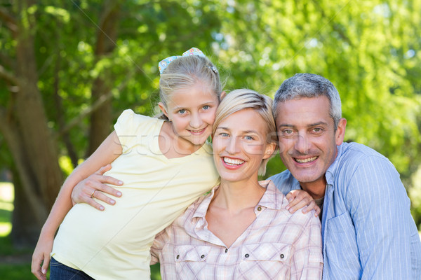 Stock photo: Happy parents with their daughter 