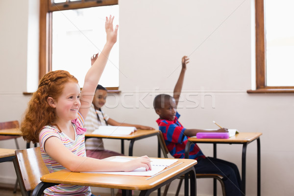 Pupils raising their hands during class Stock photo © wavebreak_media