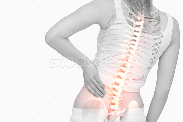 Stock photo: Highlighted spine of woman with back pain